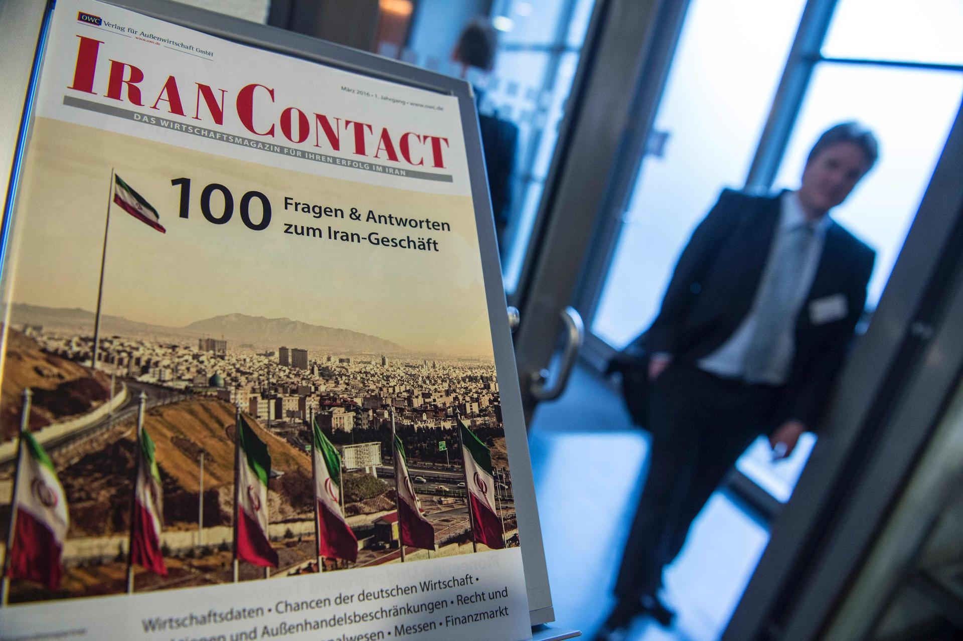 A brochure answering questions on investment in Iran is seen at the German-Iranian Business Forum in Berlin on March 3, 2016. / AFP / John MACDOUGALL